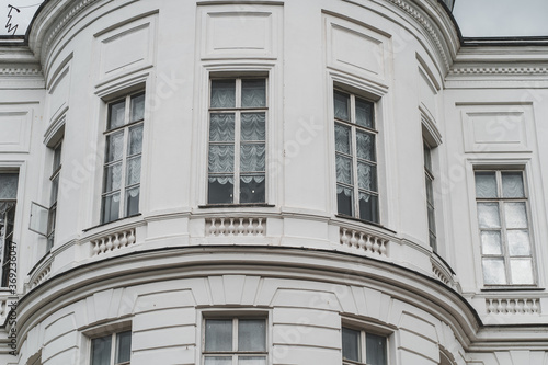 Close up of big windows of manor. Texture of windows of historic white Palace.