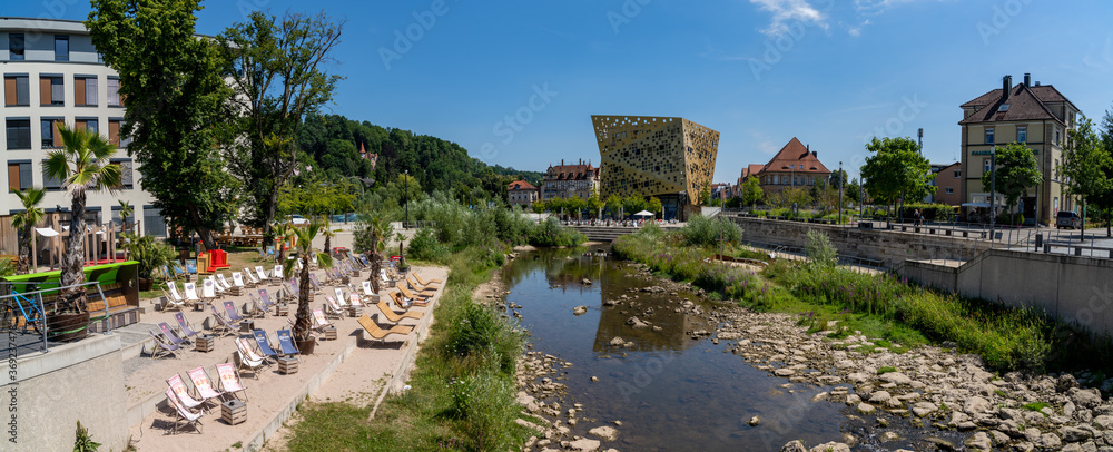 Fototapeta premium the Rems River with the Forum Gold und Silber building in Schwaebisch Gmuend