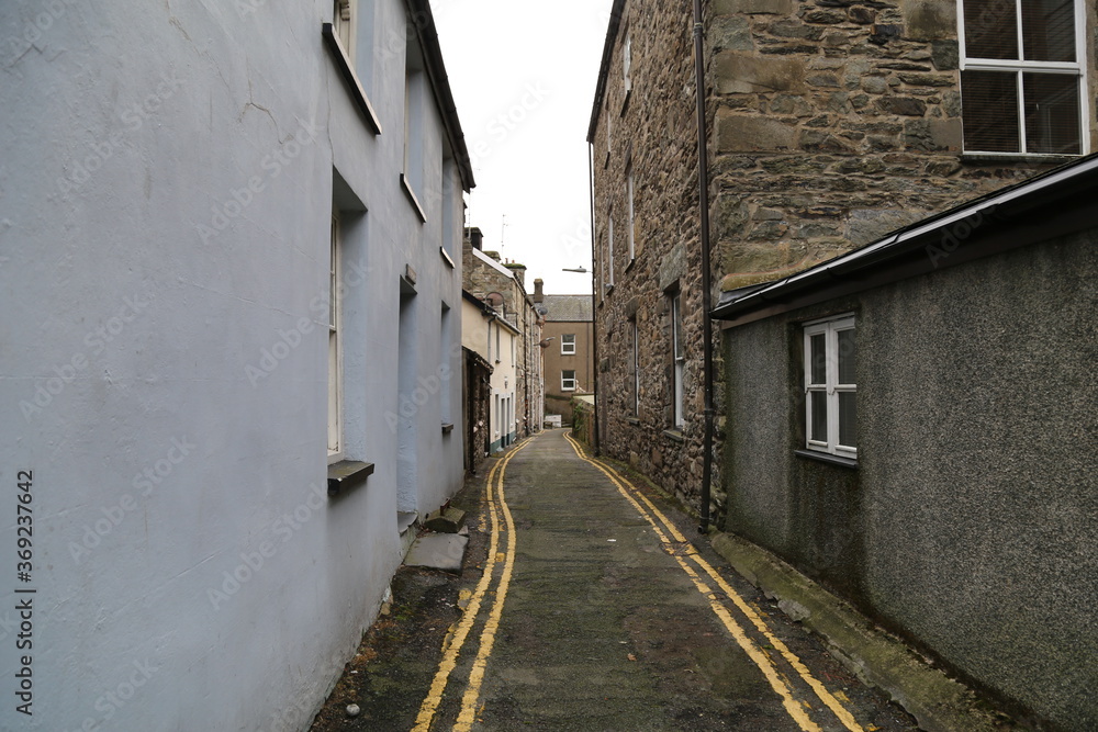 A very narrow, quaint back street in the seaside town of Barmouth, Gwynedd, Wales, UK.