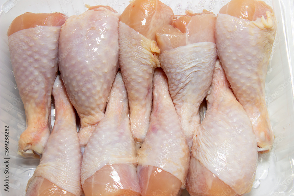 Close - up of fresh, chicken thighs, legs Close - up of fresh, chicken thighs, legs