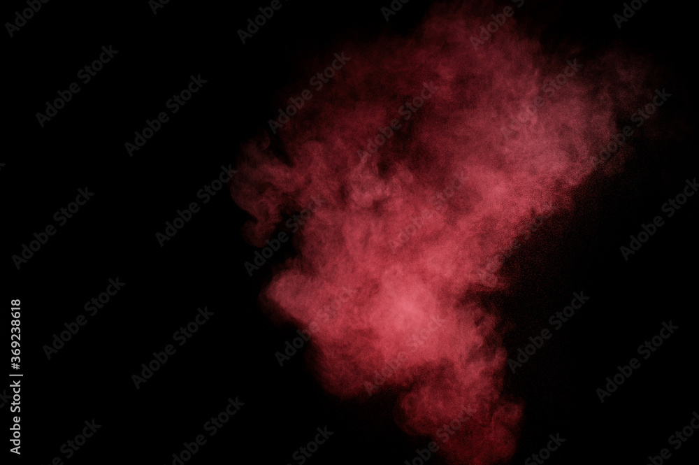 Red and pink powder explosion on black background. Colored powder cloud. Colorful dust explode. Paint Holi. Red and pink powder explosion on black background. Colored powder cloud. Colorful dust explode. Paint Holi.