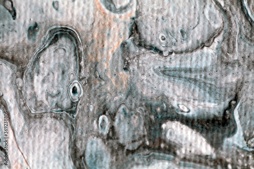 Macro detail of an abstract painting showing an imaginary underwater scene with a teddy bear and a one eyed puppet, in grey and white tones with visible canvas texture and blurriness, creating depth. 