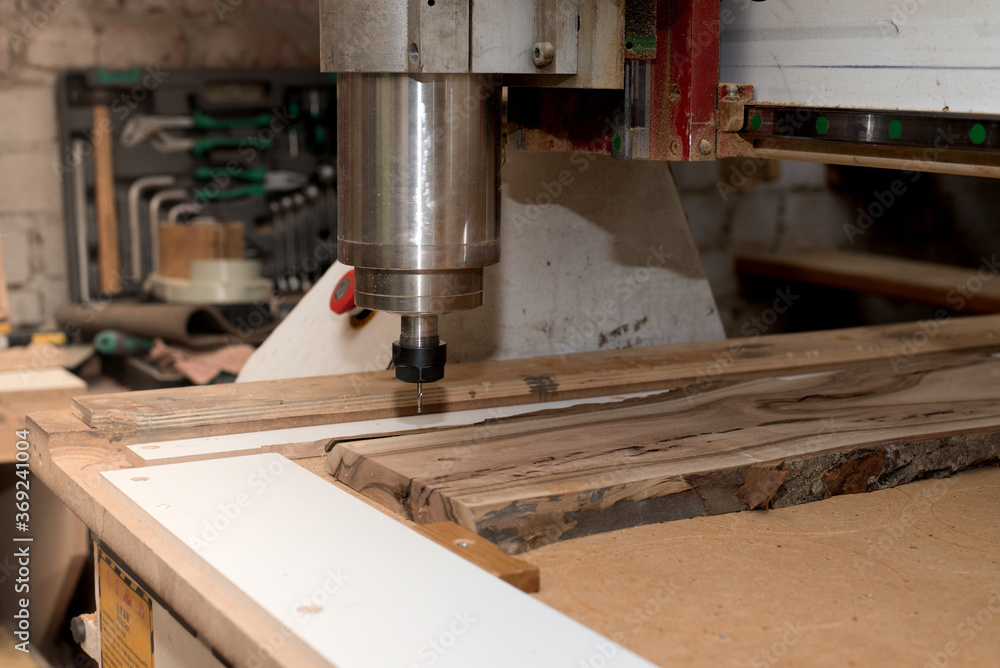 Woodwork cnc machine working on wood board. Tool at the wood factory. Woodwork cnc machine working on wood board. Tool at the wood factory.