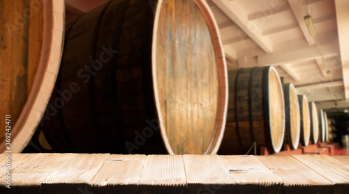 Old wooden barrel on a brown background