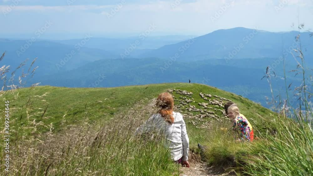 active family mother and daughters hiking at the mountains
active family mother and daughters hiking at the mountains