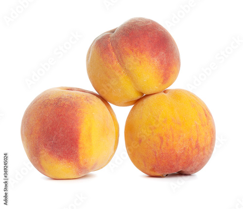whole ripe yellow peach isolated on a white background