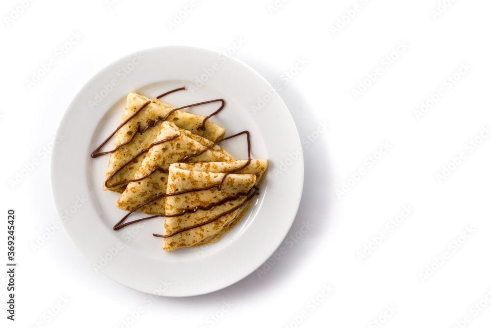 Sweet crepes with chocolate isolated on white background. Top view. Copy space