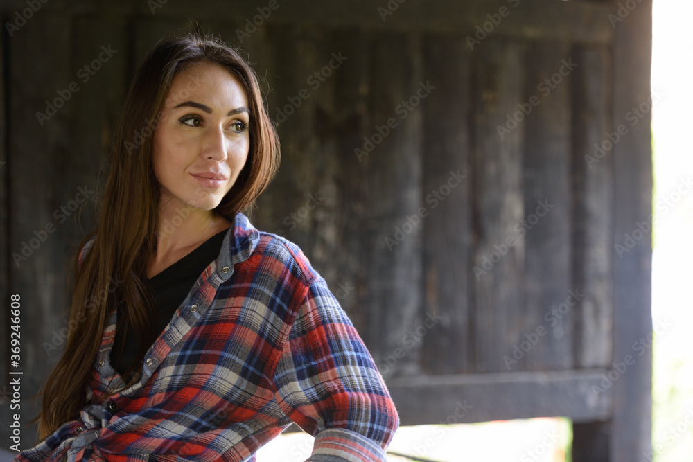 Portrait of young beautiful hipster woman in the city streets Portrait of young beautiful hipster woman in the city streets
