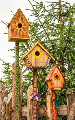 Photography Bright wooden painted bird houses