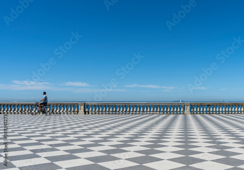 La panoramica Terrazza Mascagni (Mascagni Terrace) a Livorno, Toscana, Italia, con il caratteristico pavimento a scacchiera e una splendida vista sul mar Tirreno. photo