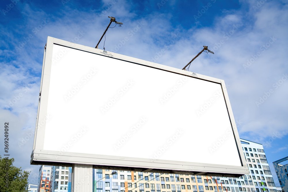 Billboard in the city against the background of colored houses Mockup for advertising Billboard in the city against the background of colored houses Mockup for advertising