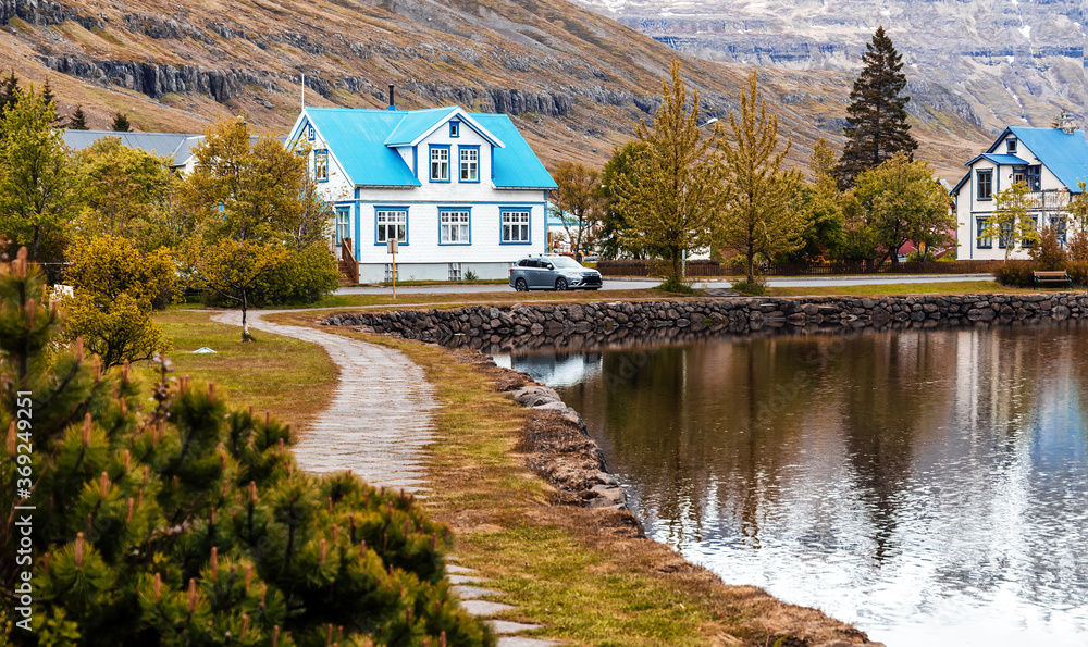 Wonderful landscape of Iceland. Gorgeous view of small town Seydisfjordur on East Iceland. The rural town with picturesque buildings. Creative image best locations for photographers in Iceland.