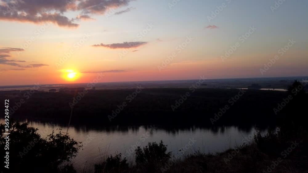 View of sunshine dramatic sky on river bank. Sunset scenic sky in summer evening. Timelapse View of sunshine dramatic sky on river bank. Sunset scenic sky in summer evening. Timelapse