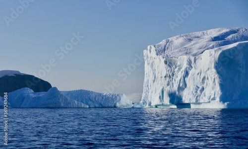 Blue iceberg in antarctic ocean, blue sky and sun, melting ice, Antarctica © HWL Photos