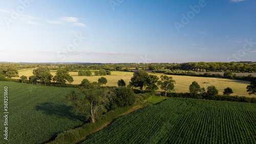 Aerial shot of green agricultural farmers fields near Glastonbury, Somerset. 