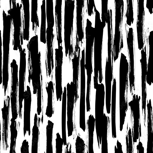 Seamless vector pattern made by hand drawn paint strokes. Black and white abstract background. 