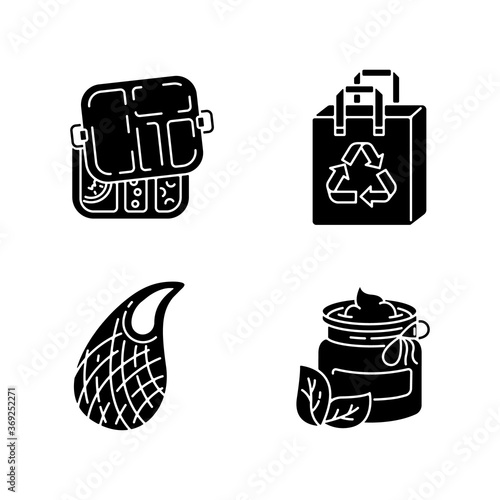 Environmentally safe products black glyph icons set on white space. Mesh bag, organic cosmetics, reusable bag and lunch box silhouette symbols. Sustainable lifestyle. Vector isolated illustrations
