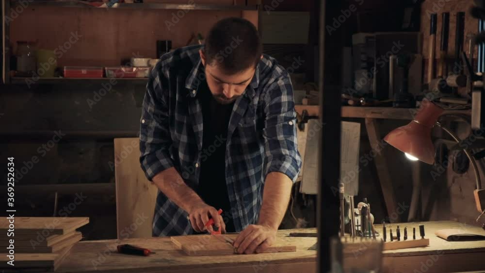 Carpenter working with wood at workshop Carpenter working with wood at workshop