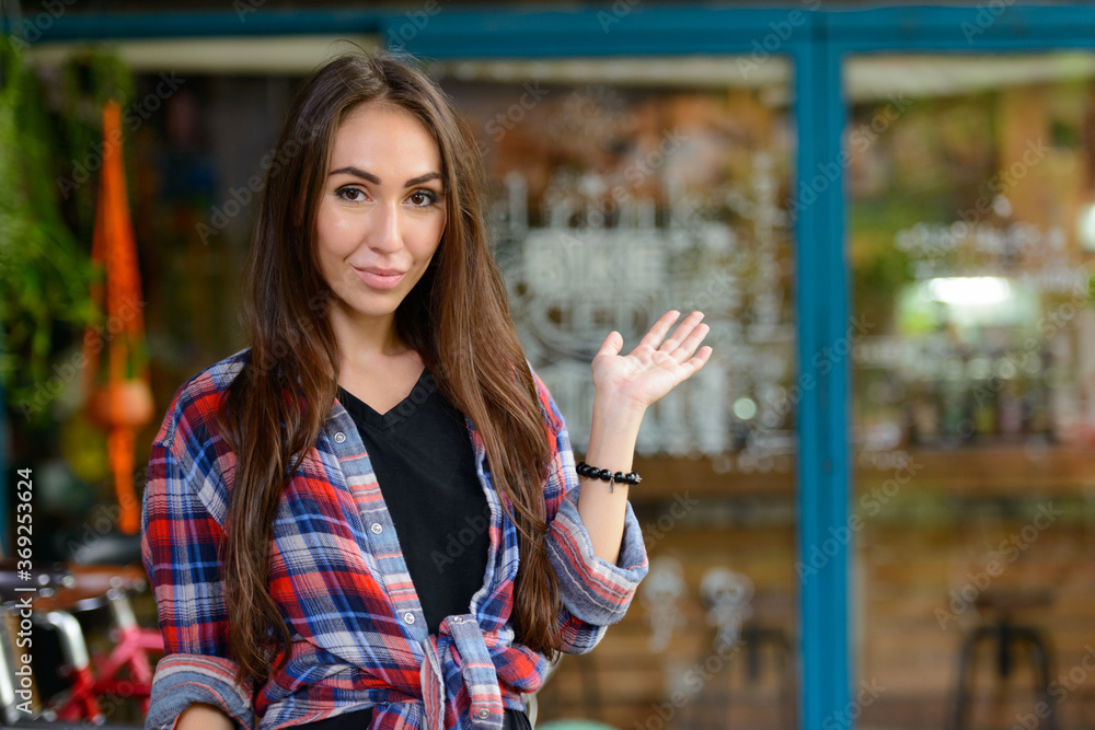 Young beautiful hipster woman at the coffee shop outdoors Young beautiful hipster woman at the coffee shop outdoors