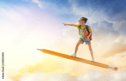 child flying on a pencil