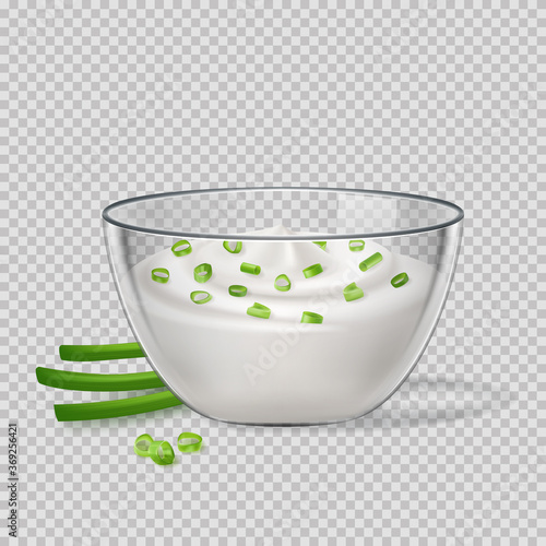 Sour cream sauce and green onion flavor, in glass transparent bowl, tartar, yogurt, mayonnaise. Tasty food.
