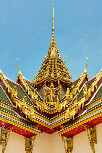 Thai Garuda caught the Naga on the roof of the palace. Red Garuda, Phra Khrut Pha,  © Meta.K