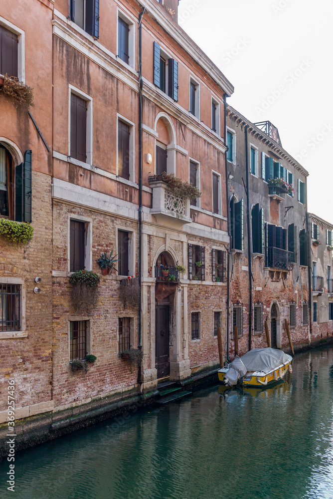The entrances on the water channels of the old palaces in Venice, as seen from a gondola