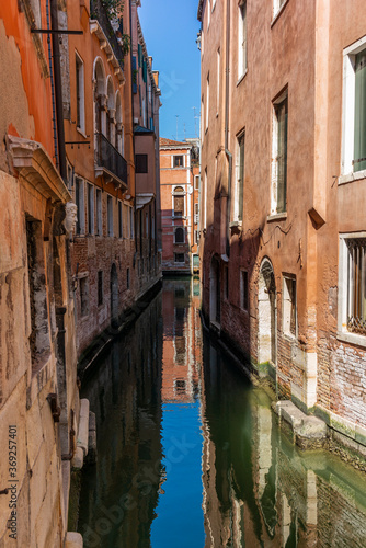 View of the water channels, bridges and old palaces in Venice at sunrise during the lockdown © gdefilip