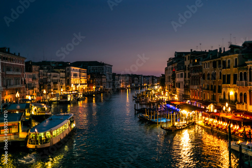 View of the  Canal Grande its palaces  and the water ferry station of Rialto in Venice at sunset from the Rialto Bridge