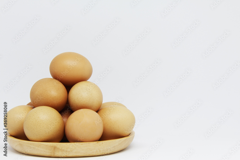 eggs in a wooden plate eggs in a wooden plate