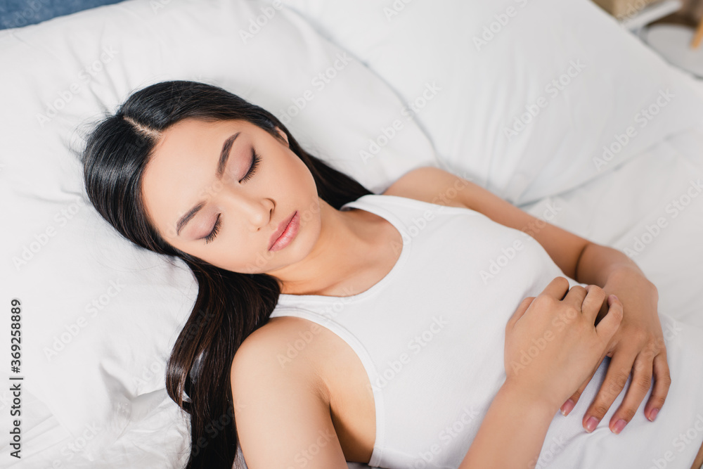 Attractive asian woman sleeping on bed at morning Attractive asian woman sleeping on bed at morning