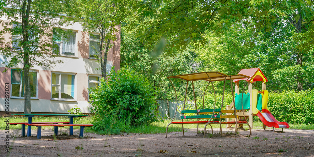 local playground with colourful attractions and benches local playground with colourful attractions and benches
