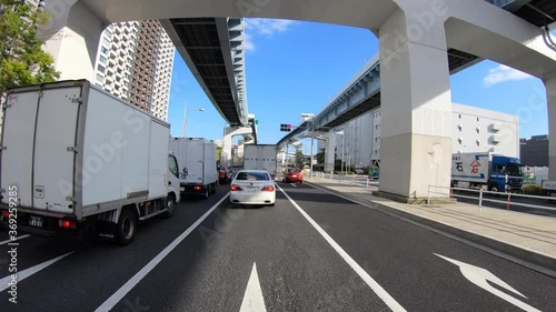 A pov timelapse of driving cityscape at Kachidoki avenue in Tokyo photo