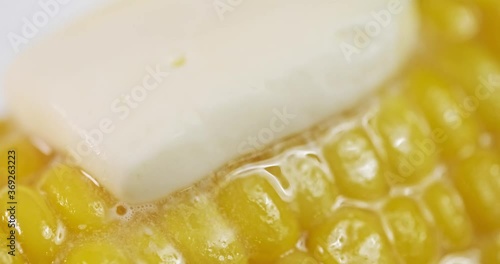 sweet farmhouse boiled corn and butter melt on it. close-up, studio shooting with macro lens