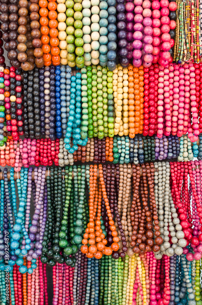 Many colorful new wooden jewelry with balls close