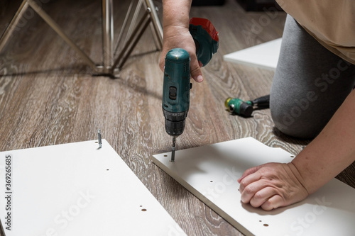 Wallpaper Mural Electric screwdriver with cruciform bat wraps into furniture cabinet Torontodigital.ca