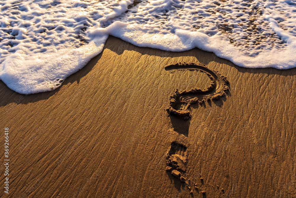 Question Mark Drawn in the Sand at the Ocean Question Mark Drawn in the Sand at the Ocean