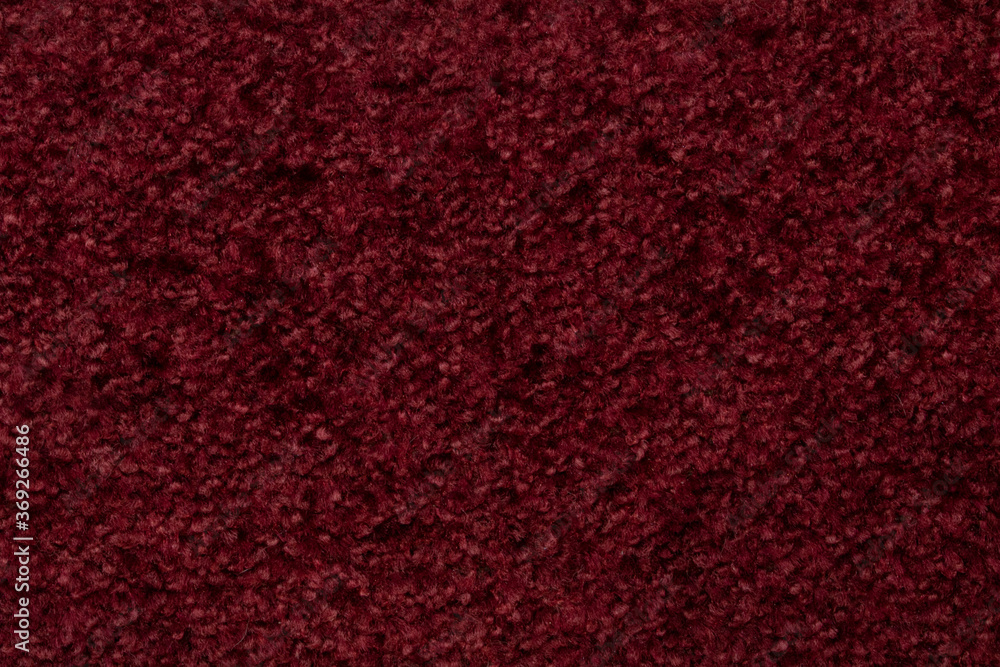 Close - up of the texture of a red woolen product