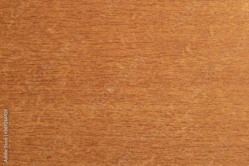 The texture of light brown wood is covered with varnish