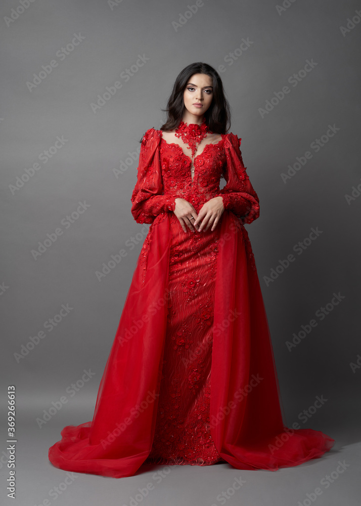 Beautiful bride on gray background. Portrait of a Bride in beautiful wedding dress. Beautiful bride on gray background. Portrait of a Bride in beautiful wedding dress.