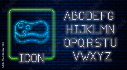 Glowing neon Sponge icon isolated on brick wall background. Wisp of bast for washing dishes. Cleaning service concept. Neon light alphabet. Vector Illustration.
