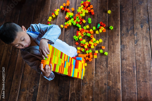 Boy playing toy puzzle photo