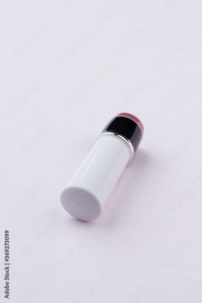 Close up white lipstic. Angle view, isolated on white. Close up white lipstic. Angle view, isolated on white.
