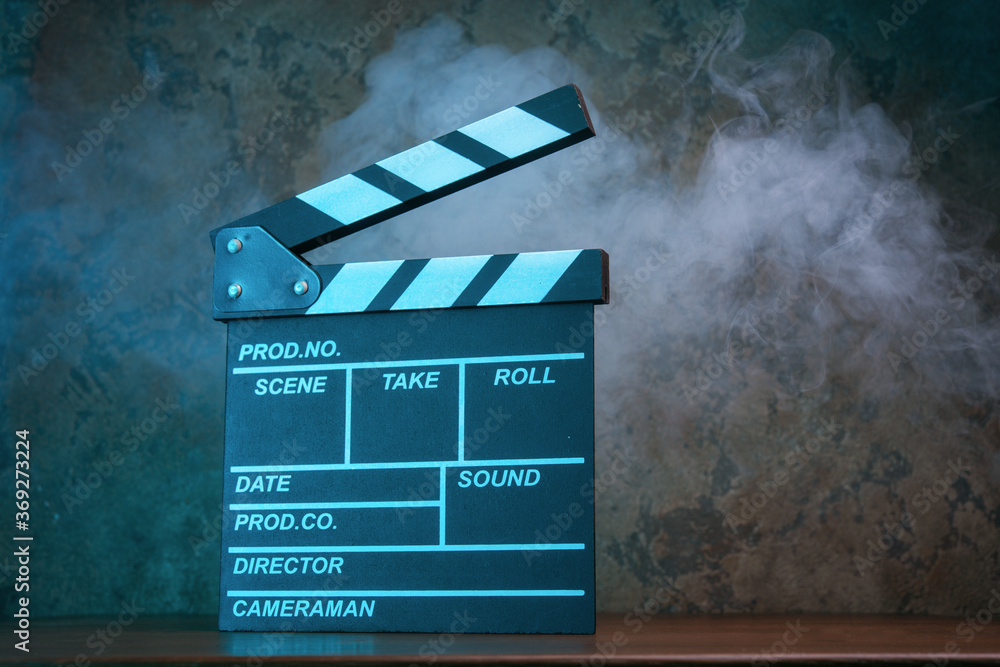 Obraz premium Movie clapperboard in blue light