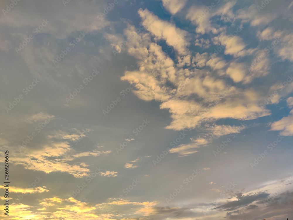 White clouds and blue sky during sunset time.Nature. Daylight.