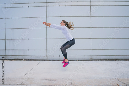 Athletic woman training in the urban area.
