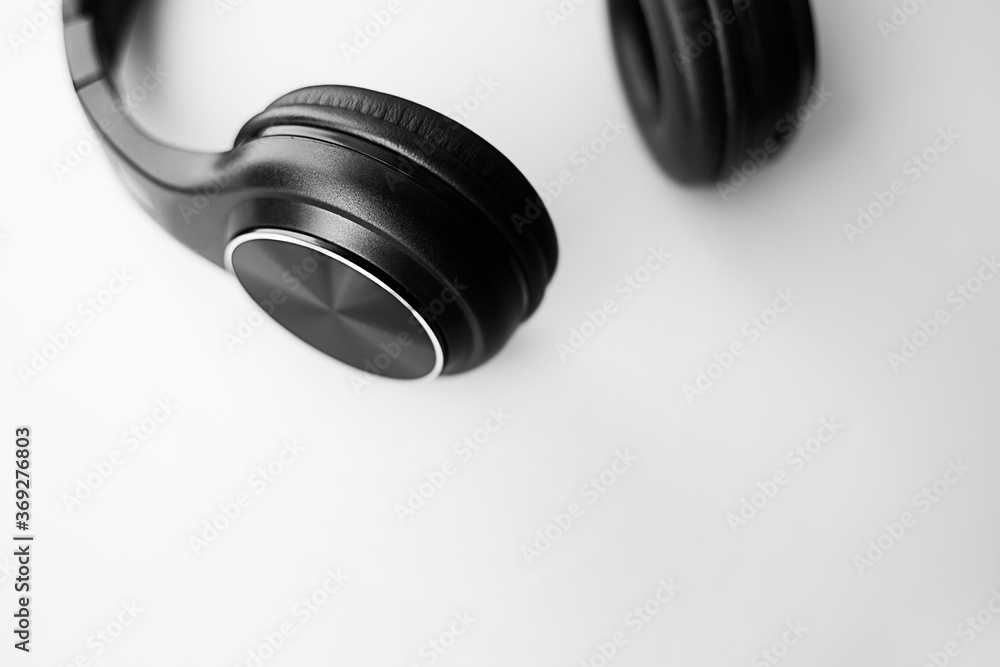 Wireless Black Headphones Isolated Background. Side View of Acoustic Stereo Sound System Wireless Black Headphones Isolated Background. Side View of Acoustic Stereo Sound System