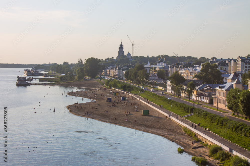 Panoramic view of the embankment and the city beach of Kostroma on the Volga river Russia on a summer evening and space for copying