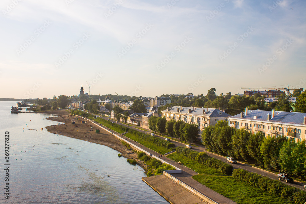 Panoramic view of the embankment and the city beach of Kostroma on the Volga river Russia on a summer evening and space for copying