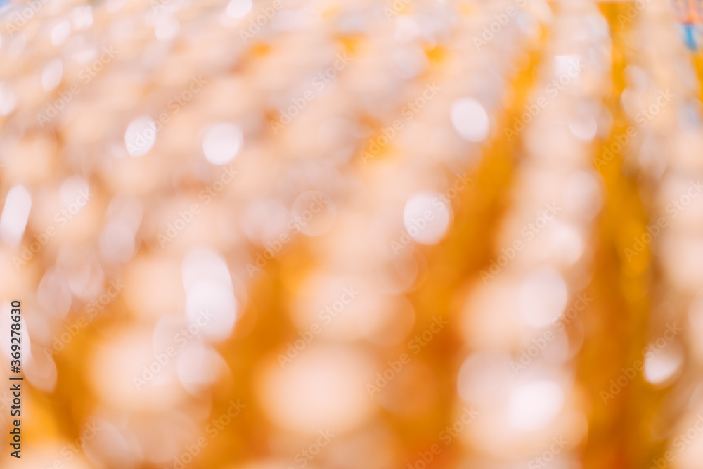 Obraz premium Abstract orange gold and yellow color bokeh blur background with copy